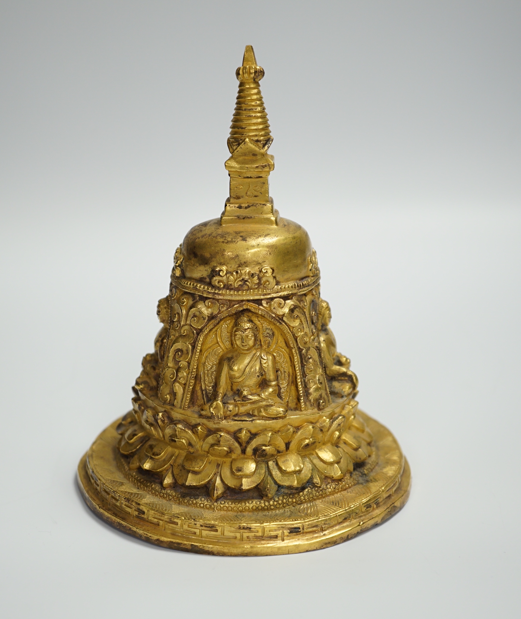 A Sino-Tibetan gilt bronze model of a stupa, 16cm high